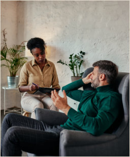 man talking to a counselor