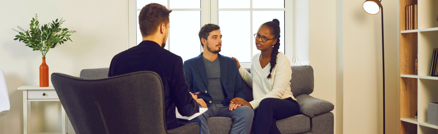 counselor and couple talking