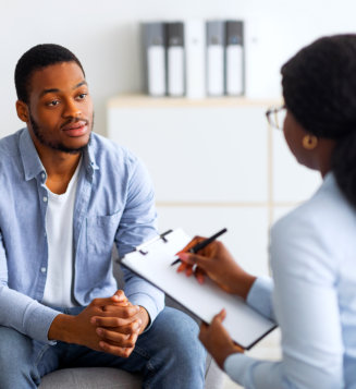 man talking to a counselor