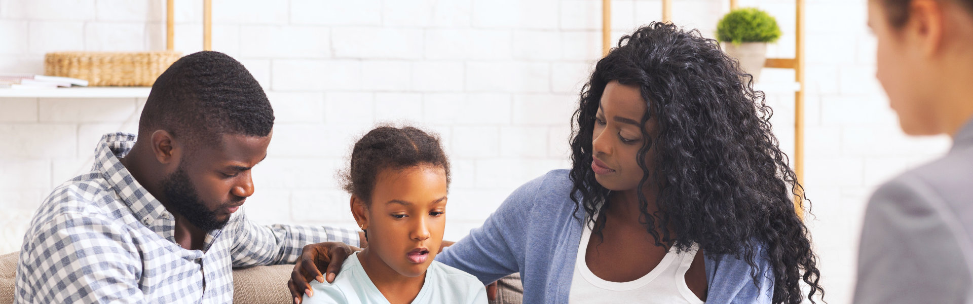 family talking to a counselor