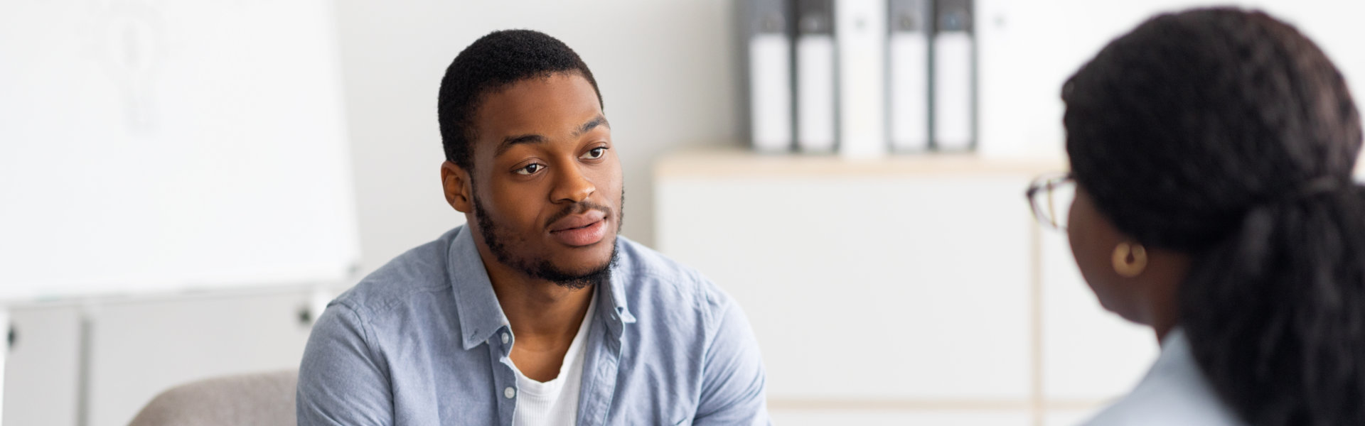 man talking to a counselor