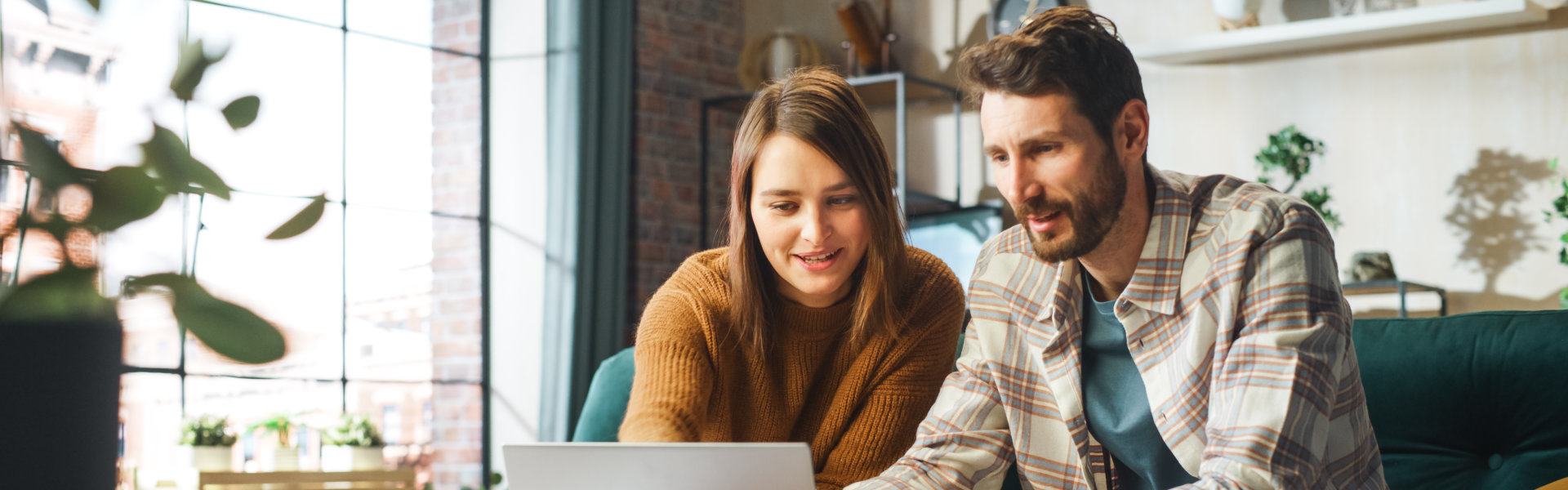 couple looking at the laptop